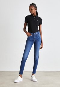 Tommy Jeans SLIM ESSENTIAL - Polo - black