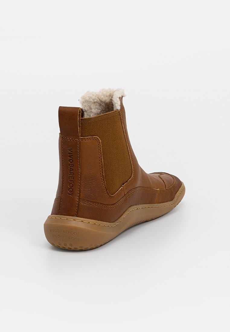 Braune Leder-Ankle-Boots mit strukturiertem Finish, elastischen Seitenpaneelen und weicher Wollfütterung. Verfügt über eine Gummisohle mit Profil.