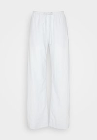 Witte losse linnen broek met elastische tailleband en trekkoord, rechte pijpen, weergegeven op een lichte achtergrond.