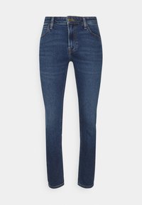 Dark blue denim jeans, slim fit design, standard waistband, five-pocket style, visible stitching, and slight fading on the thighs.