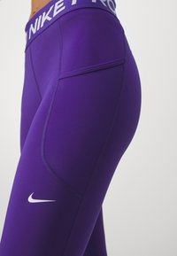 Nike Performance Tamprės - court purple
