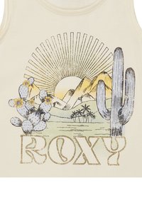 Svetlý krémový tielko s farebnou grafikou hôr, slnka, kaktusov a textom "ROXY" v tučnom, retro písmene.