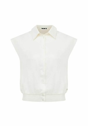 Blouse blanche sans manches avec col, boutonnage sur le devant et ourlet cintré à la taille.