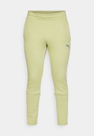 Hellgrüne Sweatpants mit schmaler Passform, elastischem Bund, seitlichen Taschen und einem kleinen grauen Puma-Logo am linken Oberschenkel.