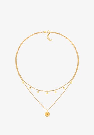 Zlatá dvojitá náhrdelník obsahujúci dve retiazky. Jedna retiazka je jednoduchá, zatiaľ čo druhá má päť diskových príveskov a centrálny prívesok v tvare slnečného lúča.