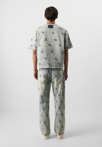 Don't Waste Culture SALEH UNISEX - Loose Jeans - pale