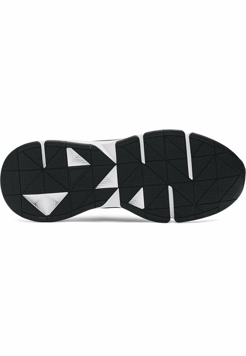 Suola di scarpa sportiva in bianco e nero con un motivo testurizzato e triangolare per trazione e grip. Il design include accenti bianchi angolari.