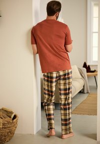Next MOTIONFLEX COSY SET pomarańczowy