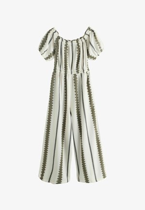 Salopetă albă cu dungi verticale în zigzag olive și negru, mâneci scurte bufante, decolteu și talie elasticizate, pantaloni cu picioare largi.