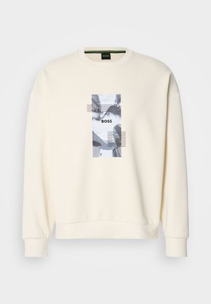 Cream-colored sweatshirt with a crew neck, long sleeves, and a central graphic print featuring the word "BOSS" and abstract patterns in gray.