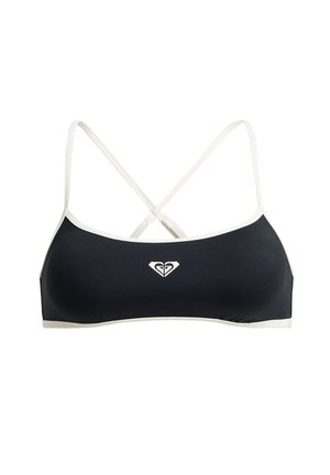 Fekete-fehér sportmelltartó vékony, keresztbe átfedő pántokkal és egy kis, középen elhelyezkedő logóval az elején.