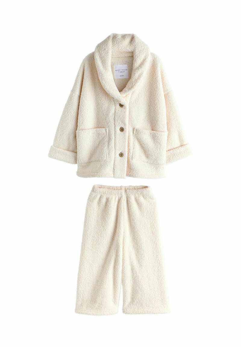 Cremefarbener, flauschiger Fleece-Loungewear-Set mit Jacke zum Knöpfen, die große Taschen aufweist, und passenden, weiten Hosen mit elastischem Bund.
