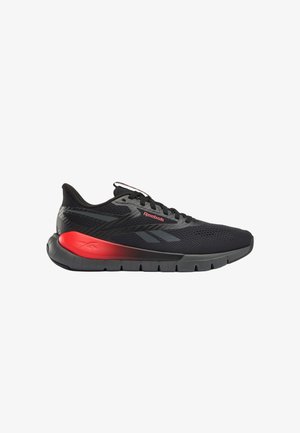 Scarpa da corsa Reebok nera e grigia con suola intermedia sfumata rossa, tomaia in mesh e lacci neri, mostrata di profilo su sfondo bianco.