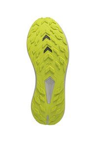 Suela de un zapato con una superficie de goma texturizada de color amarillo brillante. Presenta surcos profundos y un pequeño acento de plástico gris en el centro.