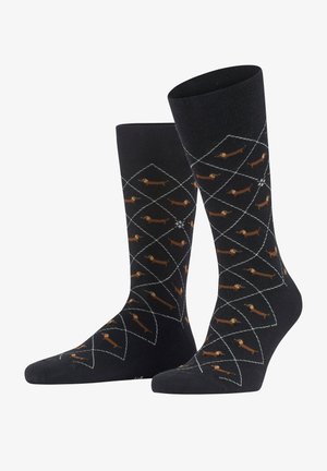 Calcetines negros con un patrón de diamantes y pequeños dachshunds marrones. Fabricados con un material suave, con parte superior acanalada y puntera reforzada.