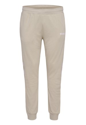 Beige joggers lavet af blødt stof, med ribbet talje, tapered ben design og hvid logo detalje foran.