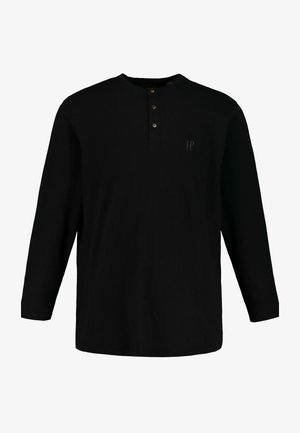 Schwarzes Langarmshirt aus Baumwolle mit knöpfbarem Henley-Ausschnitt. Verfügt über ein kleines, tonal passendes Logo auf der Brust. Weicher Stoff.