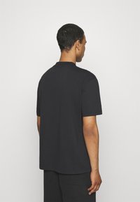 Calvin Klein Jeans VARSITY UNISEX - Majica kratkih rukava s printom - black