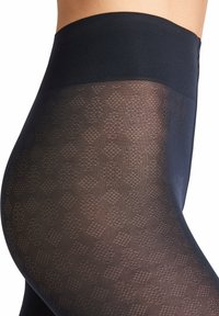 Collant neri a disegno con vita alta, caratterizzati da un design geometrico testurizzato su tutta la stoffa, finitura liscia e opacità.