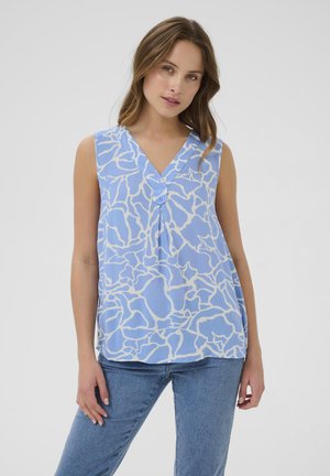 Blue sleeveless blouse with a white abstract pattern, V-neckline, and a button detail at the front, paired with light blue jeans.