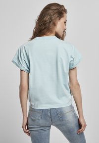 Urban Classics LADIES SHORT PIGMENT DYE CUT ON SLEEVE TEE - T-Shirt basic - seablue