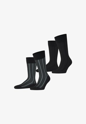 Zwart en grijs gestreepte sokken met ribbels aan de bovenrand en volledig zwarte paren, gemaakt van een zacht, elastisch materiaal. Set bevat vier sokken.