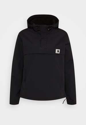 Black pullover jacket with a hood and half-zip design. Features elastic cuffs, a front pocket, and a small logo patch on the chest.