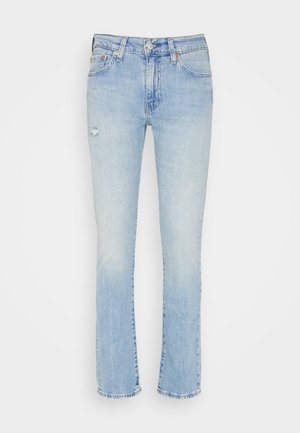 Light blue denim jeans with a straight leg fit, featuring slight distressing on the front and a frayed hem. Five-pocket design with metal hardware.