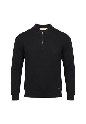 Maglione nero a maniche lunghe con colletto e cerniera frontale, con una piccola etichetta del marchio vicino all'orlo.