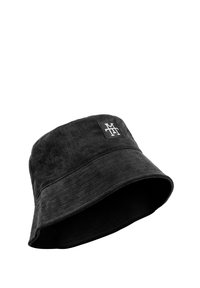Black corduroy bucket hat featuring a flat brim, textured fabric, and a small rectangular logo patch on the front.