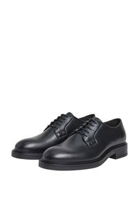 Scarpe eleganti nere in pelle con una texture liscia, punta tonda e sei occhielli. Presentano un tacco basso a blocco e dettagli di cucitura minimali.