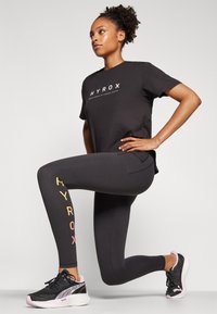 Puma HYROX CLOUDSPUN - Leggings - black