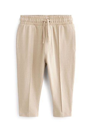 Beige elastische Bundhose mit Kordelzug, Seitentaschen und geraden Beinen aus strukturiertem Stoff.