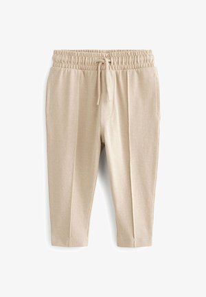 Beige elastische Bundhose mit Kordelzug, Seitentaschen und geraden Beinen aus strukturiertem Stoff.