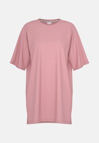 T-shirt oversize di un delicato rosa pallido, realizzato in morbido cotone, con scollatura rotonda e maniche corte, caratterizzato da un design semplice e senza cuciture.