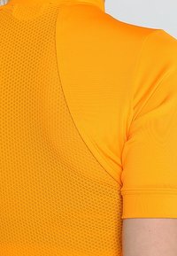 adidas by Stella McCartney T-shirt med print - orange