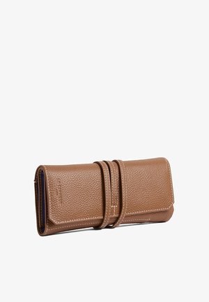 Brown leather wallet with a textured finish, featuring a wrap-around strap and white stitching. Compact rectangular shape, practical design.