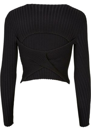 Musta ribbed-neule, jossa on pitkät hihat ja avonainen selkäosa, vyötäröllä solmittu yksityiskohta ja teksturoitu pinta.