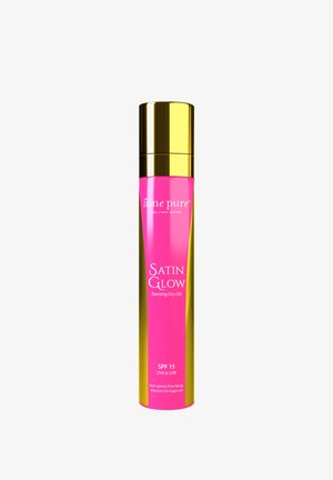Satin Glow Tanning Dry Oil in a pink and gold spray bottle. Features SPF 15, non-greasy formula, and ingredients like Vitamin E and Argan oil.