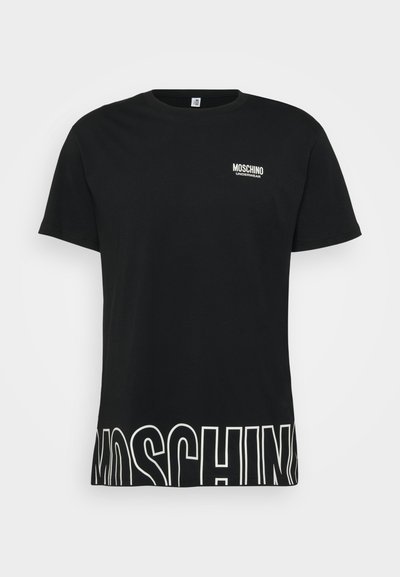 T-shirt en coton noir avec des manches courtes, un col rond et un logo blanc sur la poitrine. L'ourlet présente de grandes lettres blanches.