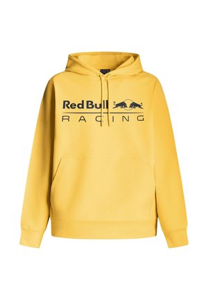 Žlutá mikina s kapucí a přední kapsou, s černým logem "Red Bull Racing" a dvěma černými grafikami býků, vyrobena z měkké tkaniny.