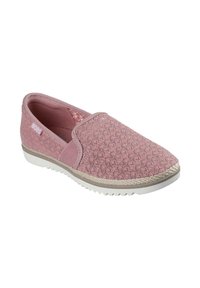 Zapatilla de color rosa claro, tipo slip-on, con parte superior de tela texturizada, paneles laterales elásticos y una suela de goma blanca con un acabado estilo yute alrededor del borde.