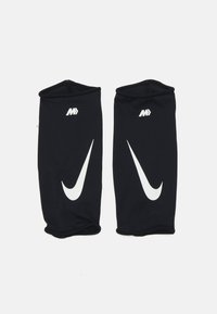 Mâneci atletice negre dintr-un material respirabil, cu logo-ul și simbolul Nike în culoare albă, având deschideri strânse și fără cusături la ambele capete.