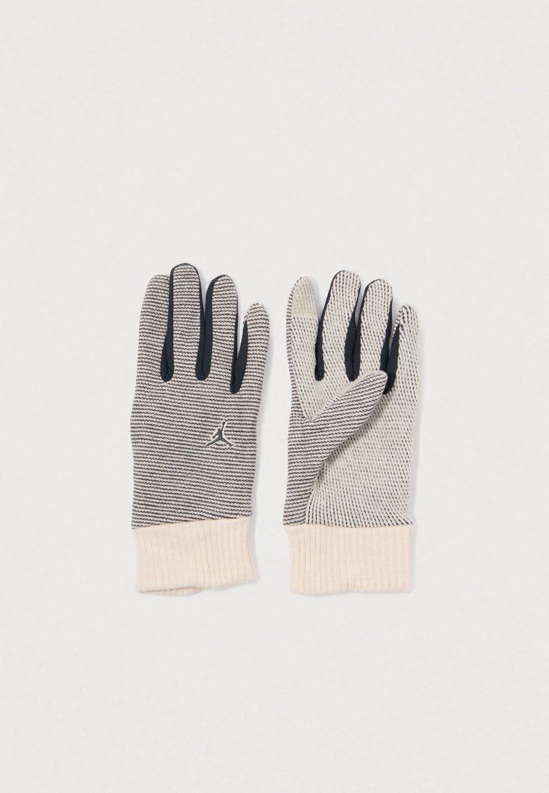 Megztos pirštinės su dryžuotu raštu, turinčios smėlio spalvos rankogalius ir juodus pirštų galus. Ant riešo yra logotipas.