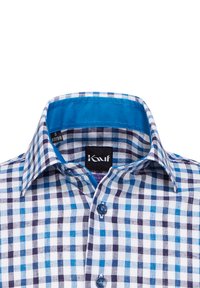 Camicia a quadri con quadrati blu e bianchi e dettagli in blu navy, colletto interno blu uniforme e un'etichetta contrassegnata "S 37/38". Tessuto di cotone.
