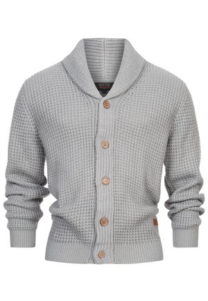 Gilet en tricot gris clair avec un col châle, des boutons en bois et des poignets côtelés. Présente un motif texturé et une silhouette ajustée.