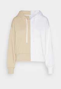 Hoodie cropped con pannelli metà beige e metà bianchi, tasca frontale, cappuccio con cordino e polsini a coste con texture di tessuto liscia.