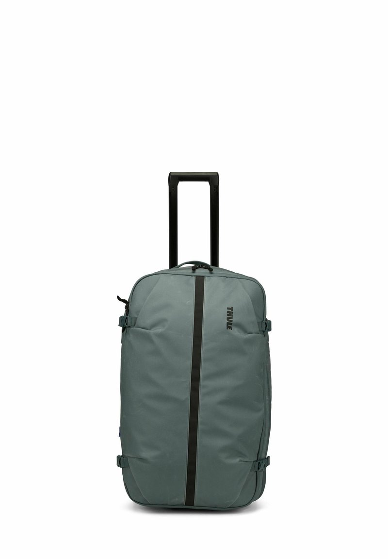 Sac à dos à roulettes souple en tissu gris, avec une bande verticale noire, deux sangles de compression latérales et une poignée télescopique.