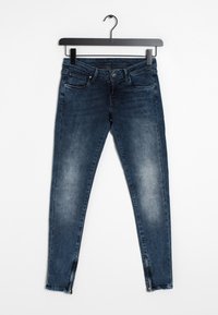 Blå denimslim jeans med en urtvättad finish, fem fickor och blixtlås vid anklarna. Materialet är mjukt med en lätt stretch.