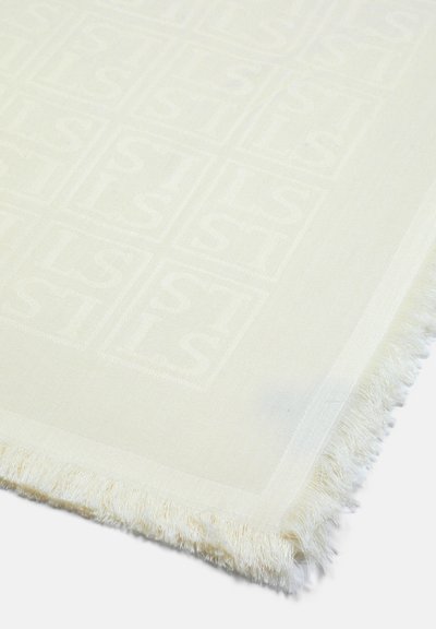 Baltas austas tekstilis, kuriame yra subtilus pakartojantis kvadratų ir raidžių raštas. Kraštai apipavidalinti švelnia, tekstūrine apdaila.